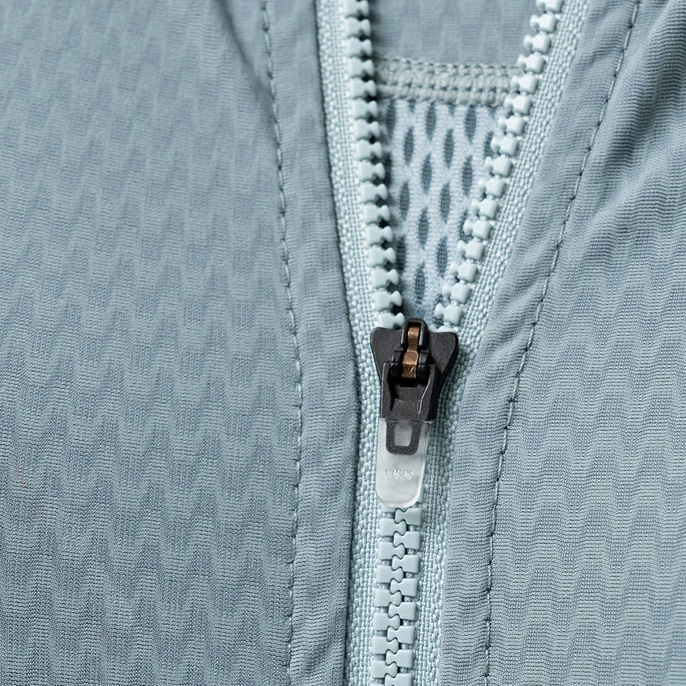 Close-up of a zipper on a textured fabric surface #Color_Blue