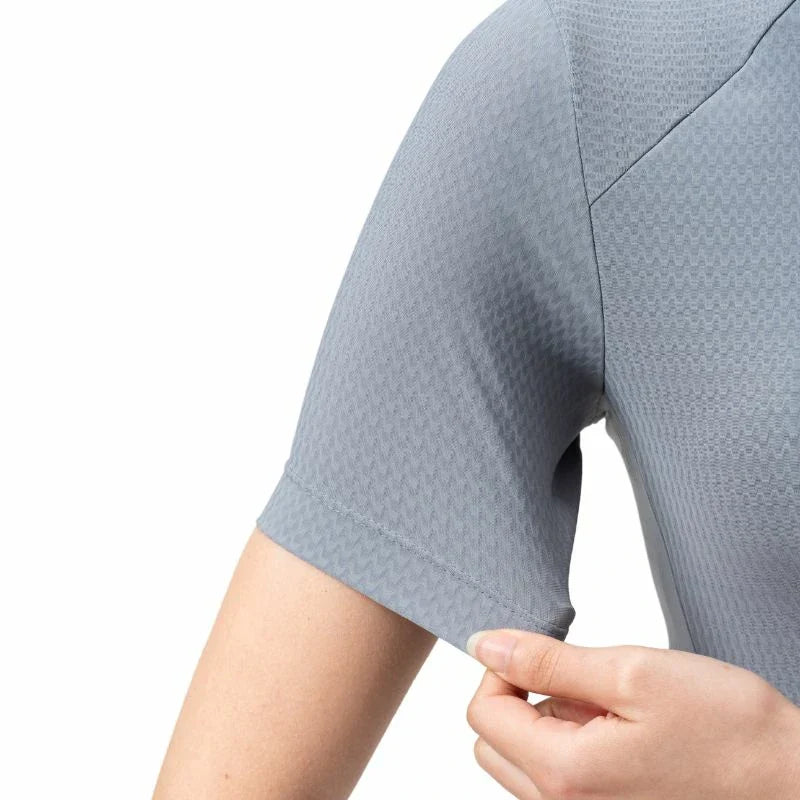 Close-up of a person wearing a textured gray shirt with a white background #Color_Blue