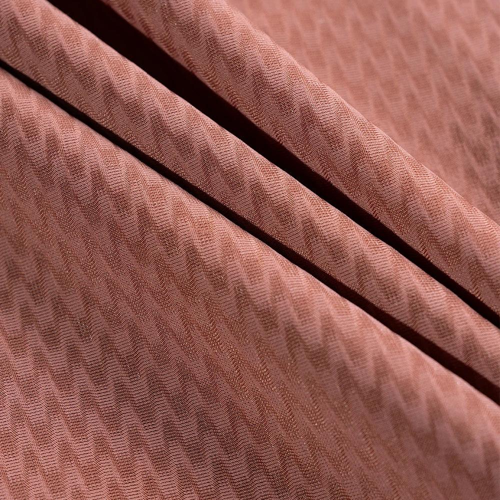 Close-up of textured brown fabric with a subtle pattern  #Color_Red