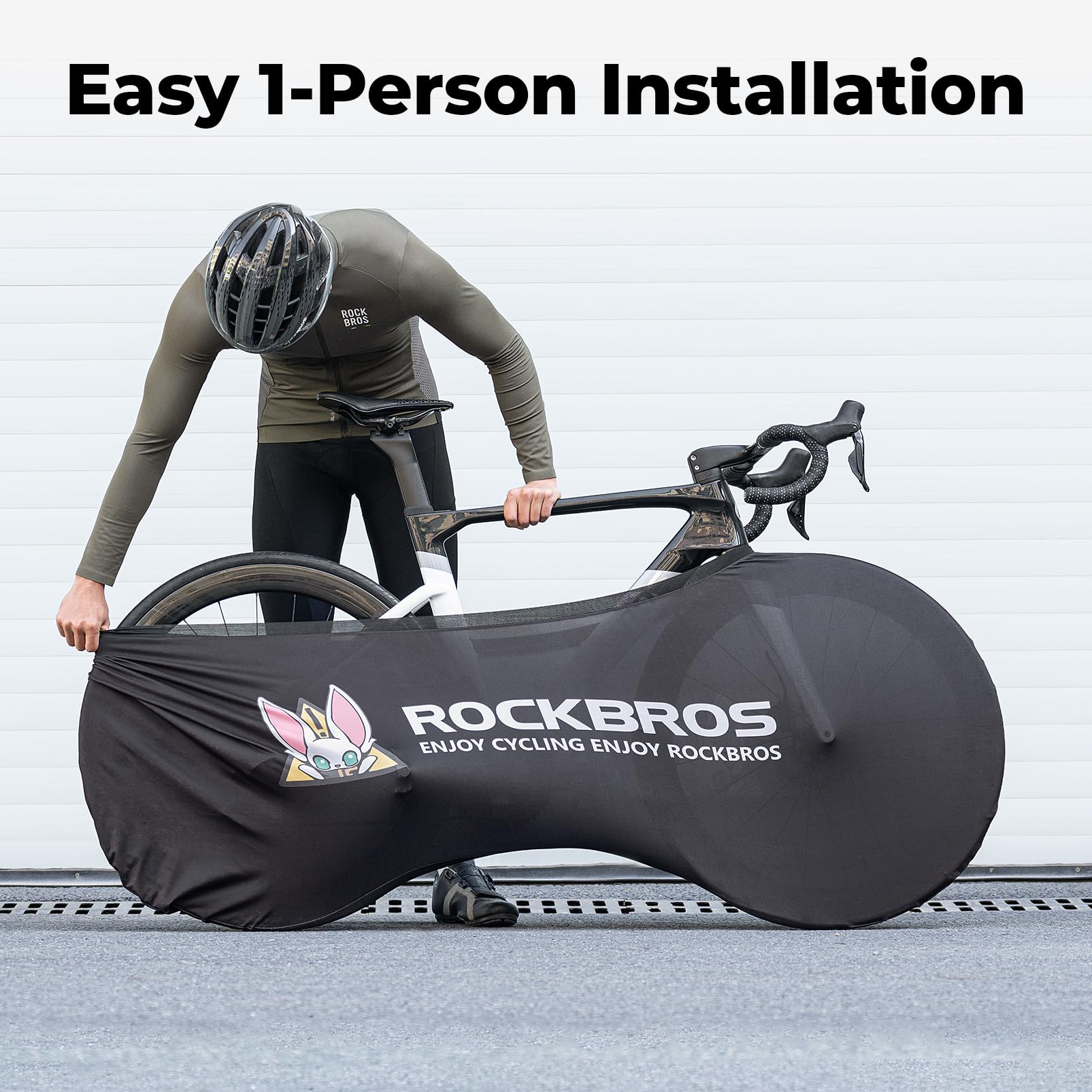 Person with a bicycle inside a RockBros bike cover, with text about easy installation. #Color_Black Rabbit