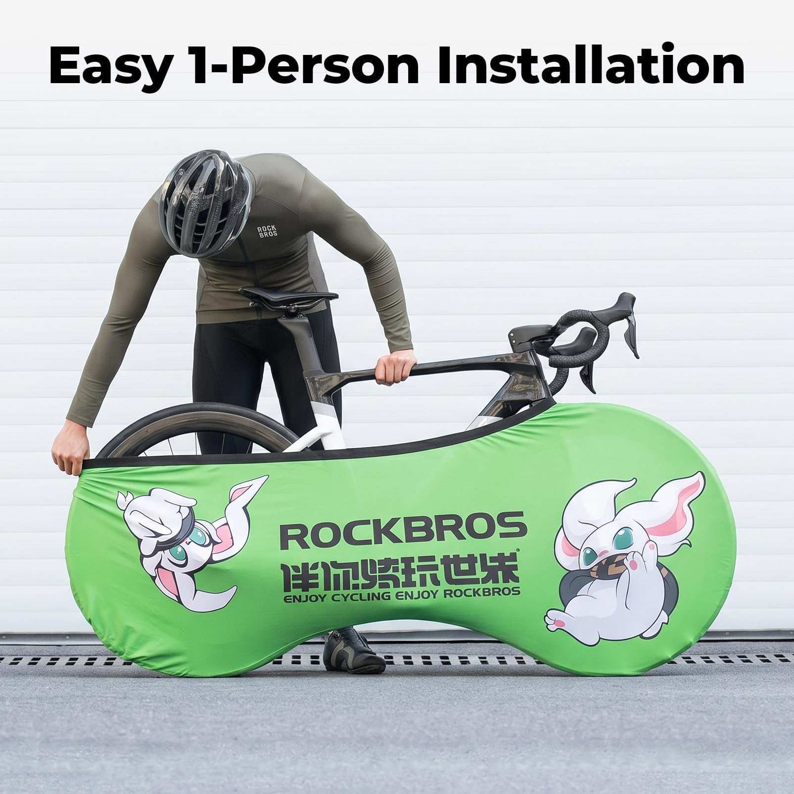 Person carrying a bicycle wrapped in a green ROCKBROS packaging with cartoon characters on a white background. #Color_Green Rabbit