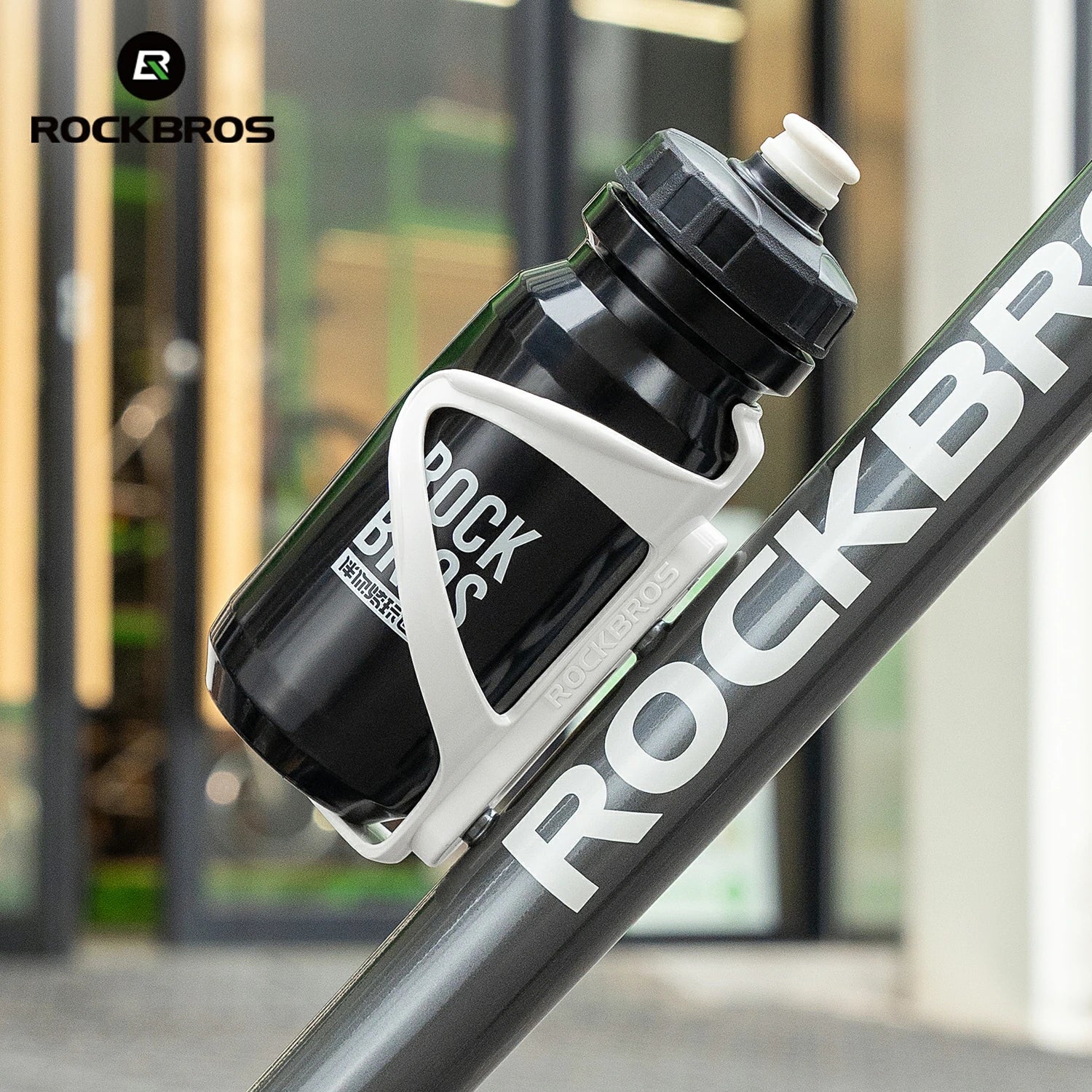 Bicycle water bottle holder with black bottle attached, featuring ROCKBROS branding.