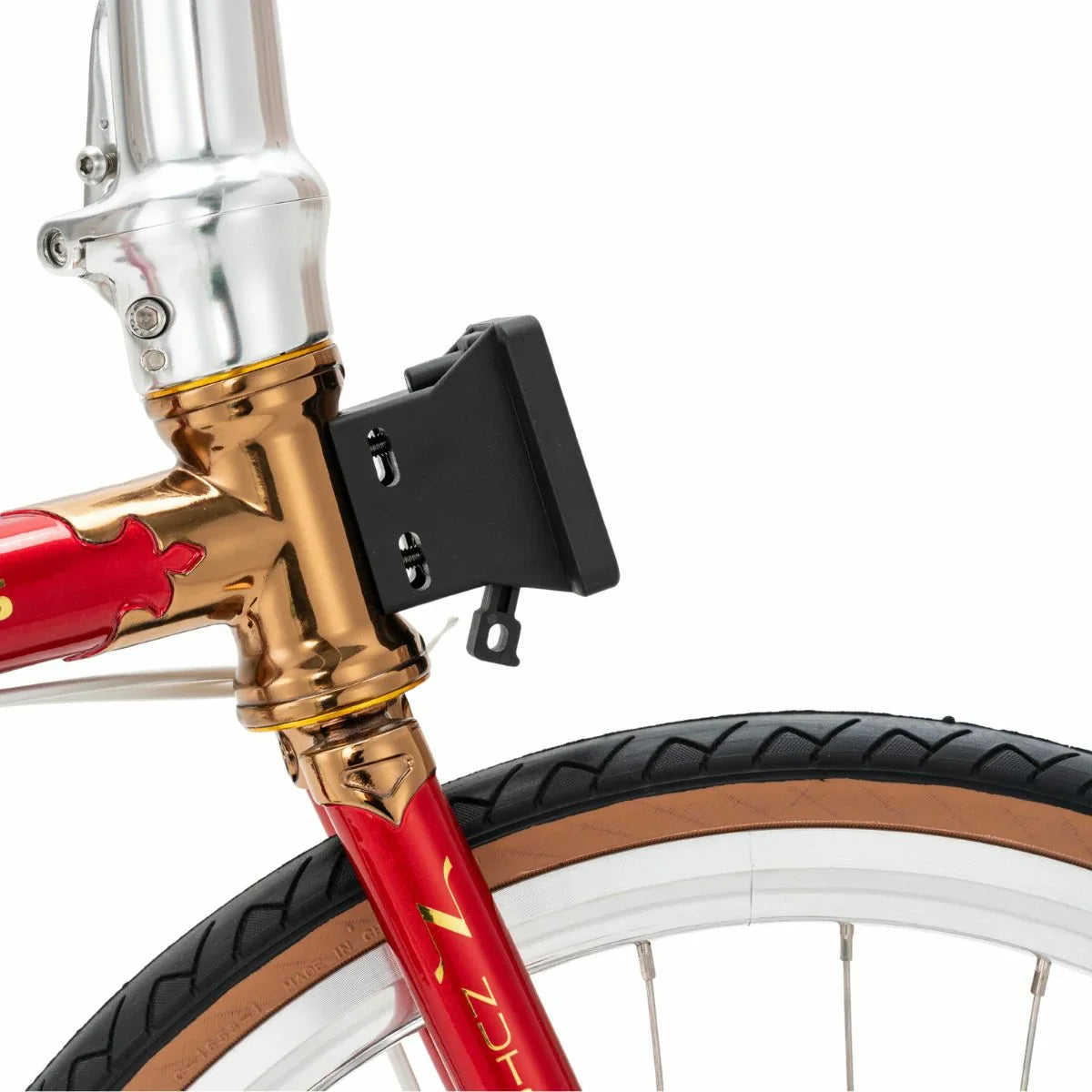 Close-up of a red bicycle with gold fork and black lock on a white background #Color_Red