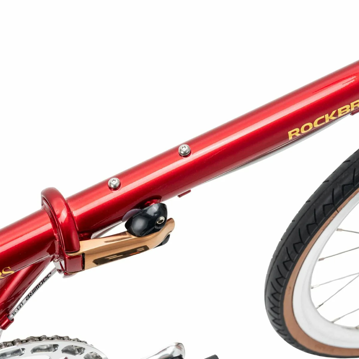 Close-up of a red bicycle frame with 'Rockbr' branding on a white  background #Color_Red