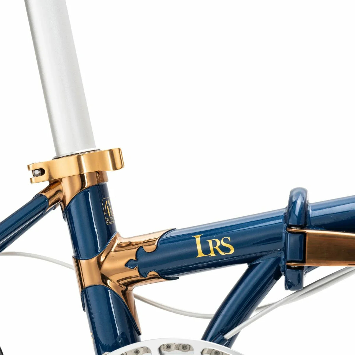 Close-up of a bicycle frame with 'LRS' branding on a white background #Color_Blue