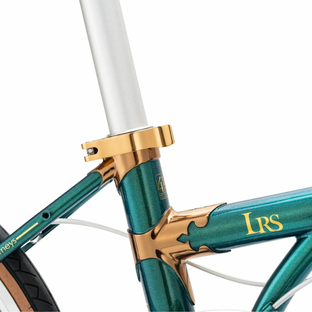 Close-up of a bicycle frame with gold accents and 'LRS' branding on a white background #Color_Green
