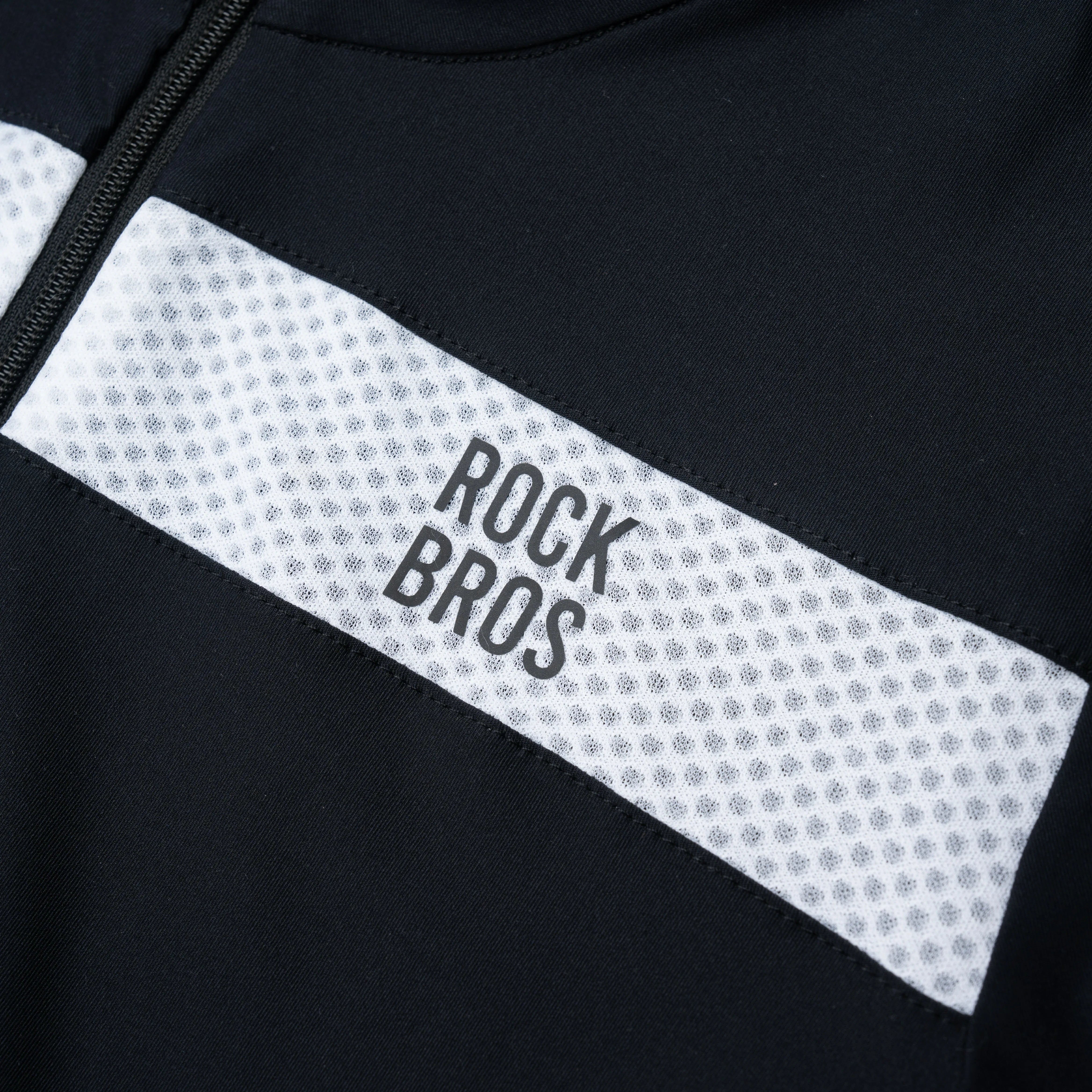 Close-up of a black and white jacket with 'Rock Bros' branding.