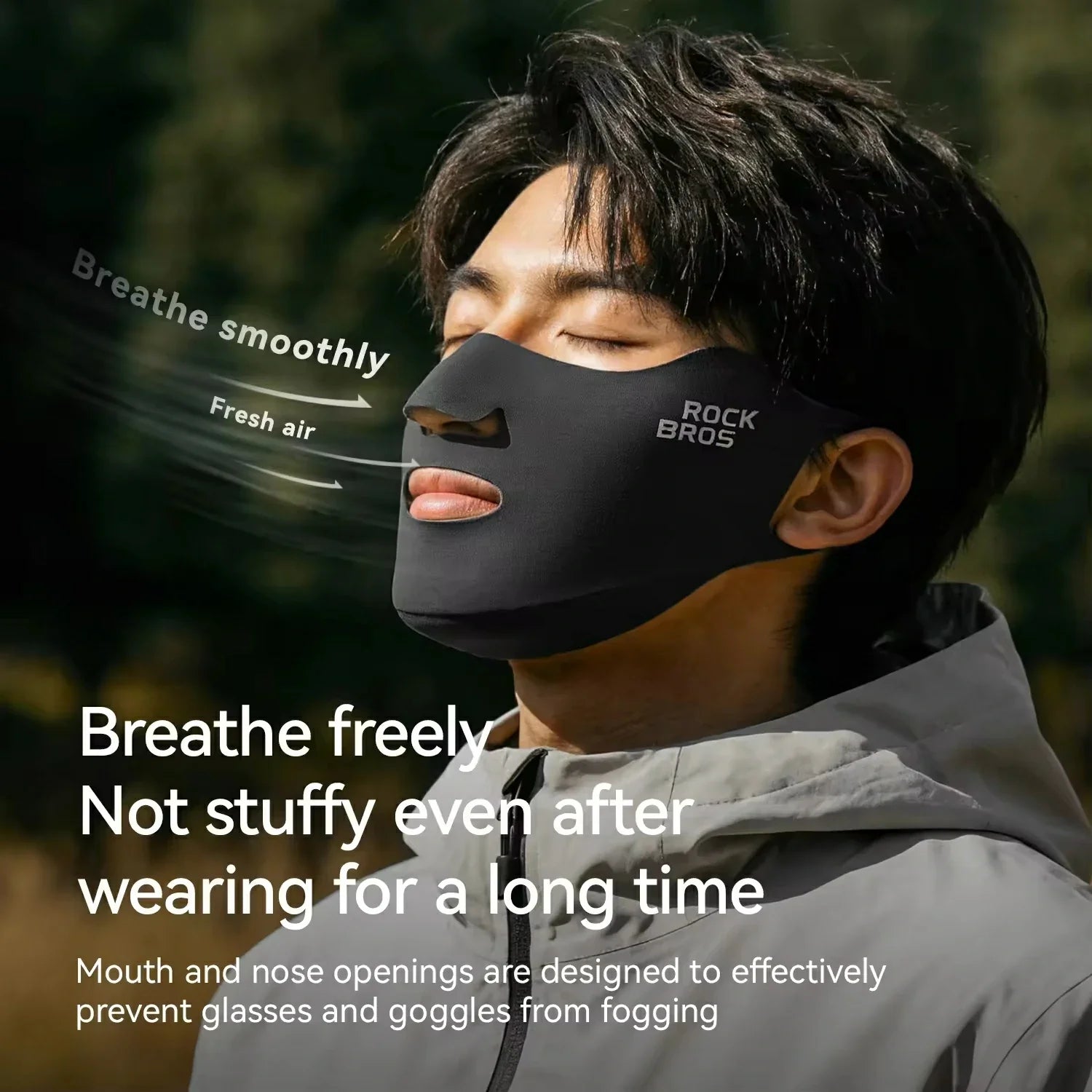 Person wearing a black face mask with text highlighting its features