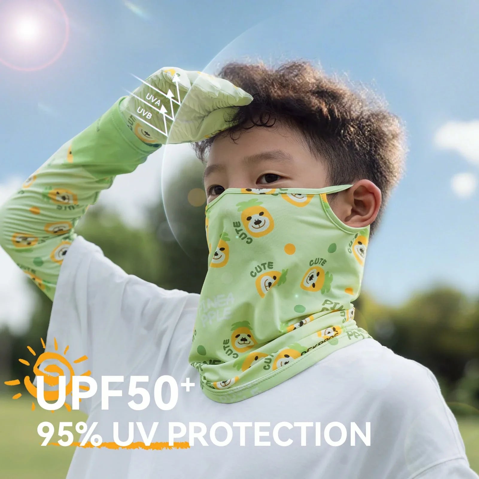 Child wearing a green UV protection neck gaiter with cartoon designs outdoors.