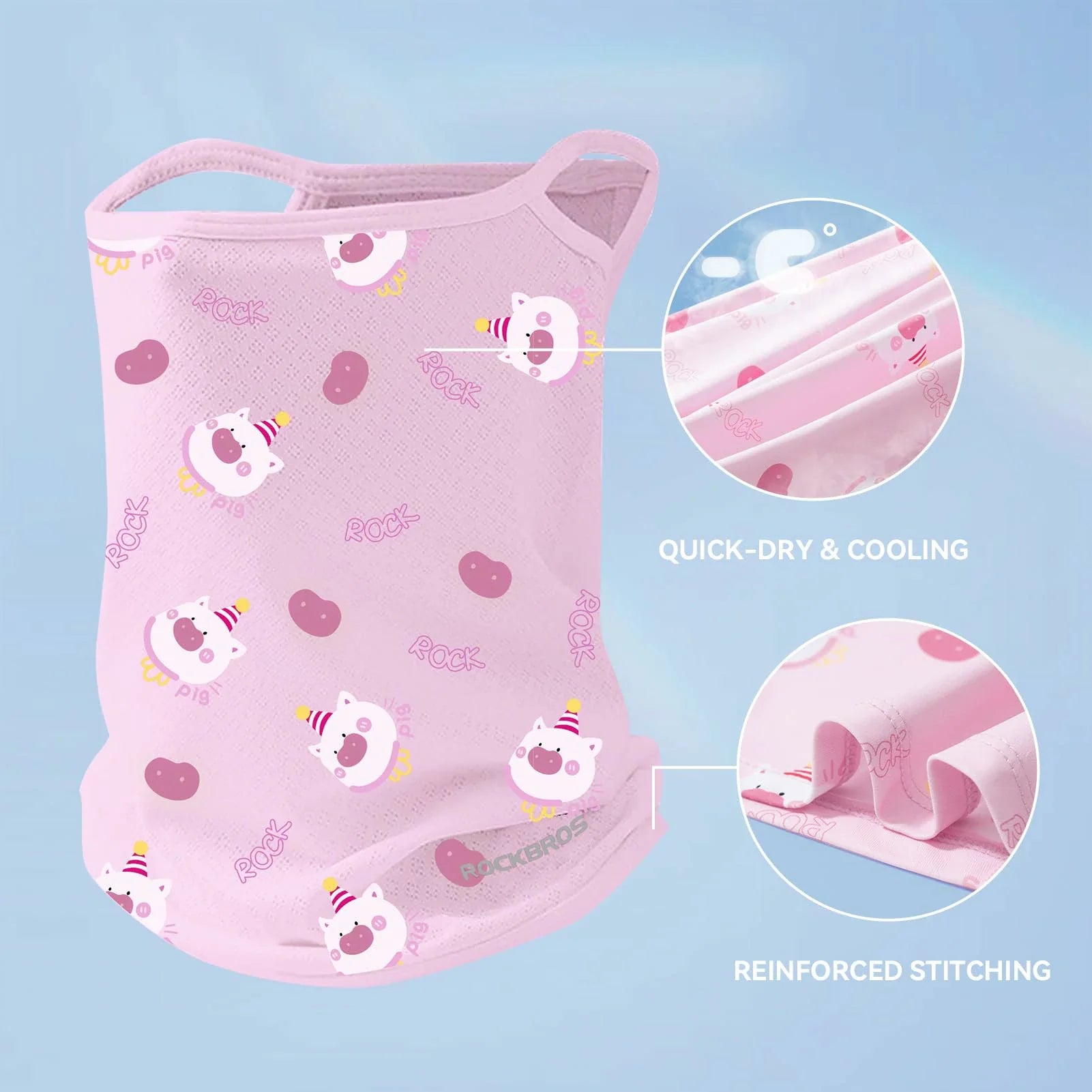 Pink children's mask with cartoon designs on a light blue background, showing quick-dry and cooling features.