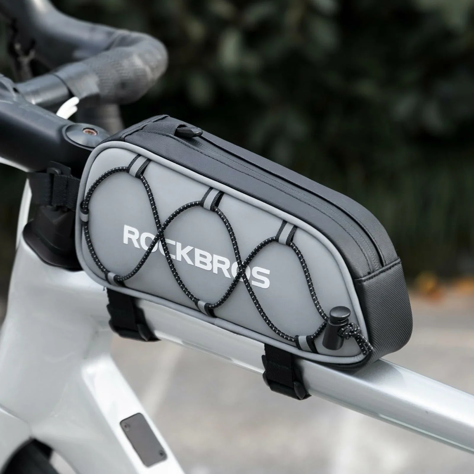 Bicycle frame bag with 'ROCKBROS' branding attached to a bike handlebar.  #color_silver