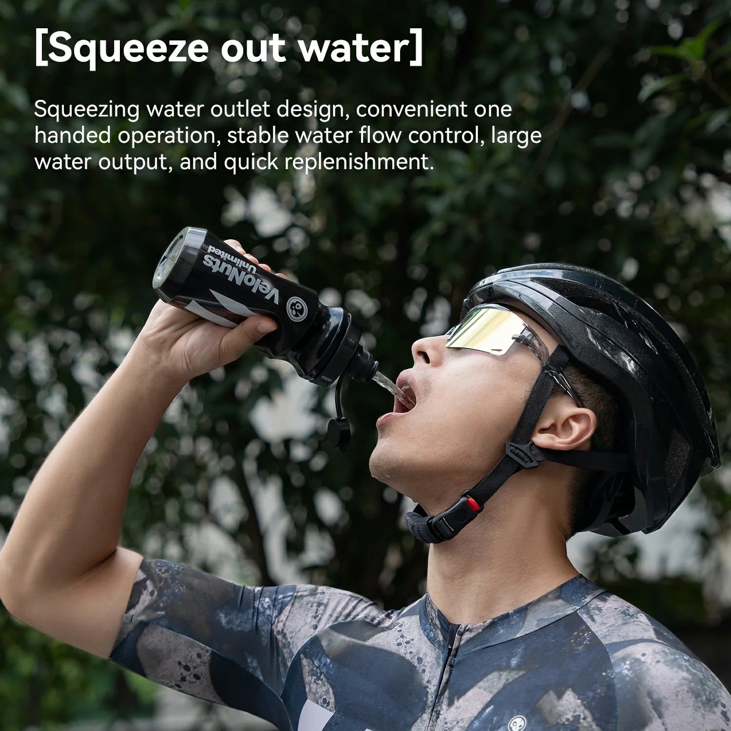 Person wearing a helmet and cycling outfit, drinking from a water bottle with text about the bottle's features.