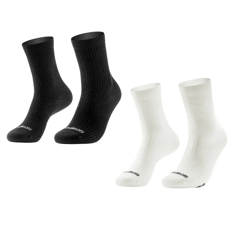 Two pairs of black socks and two pairs of white socks on a white background #Color_Black+White
