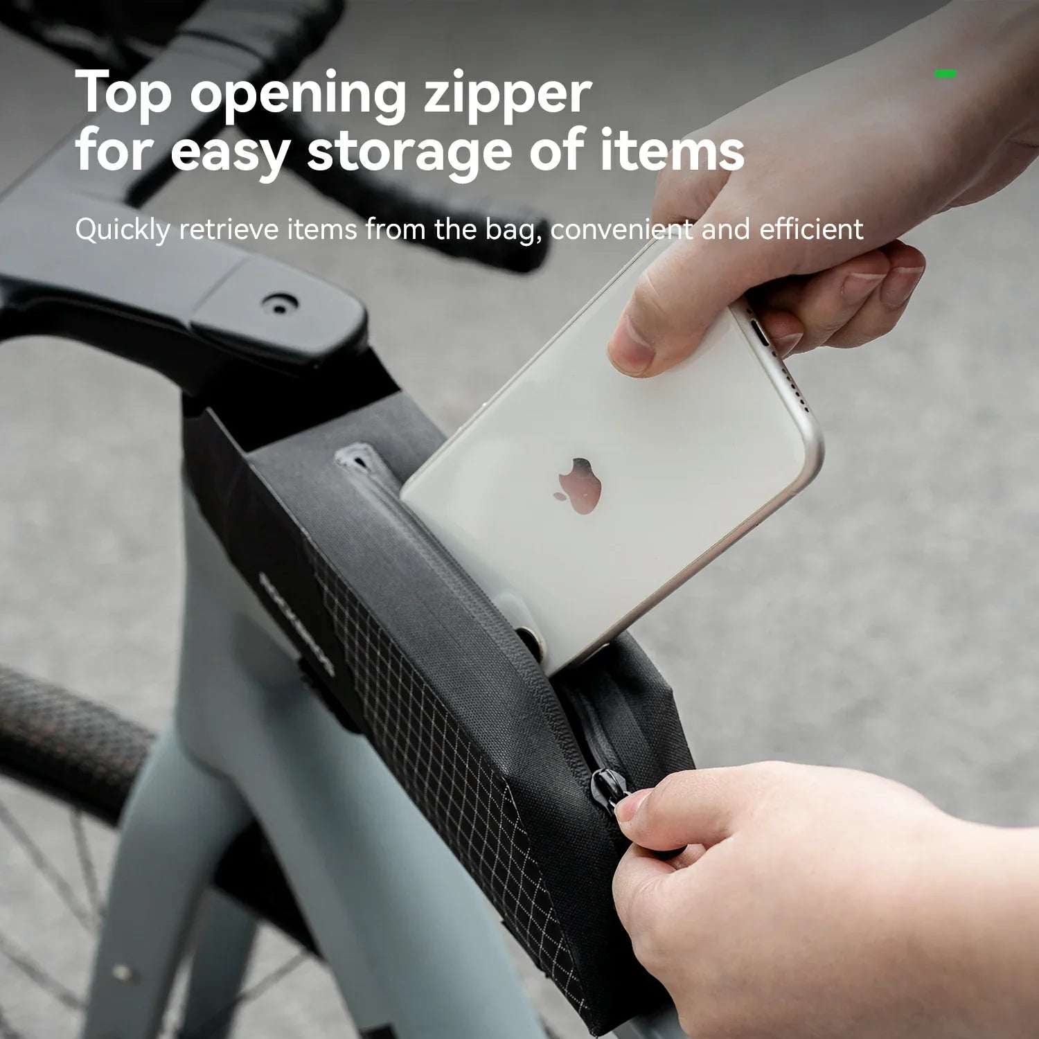 Person using a top-opening zipper on a bag to retrieve an iPhone, with text highlighting the feature.