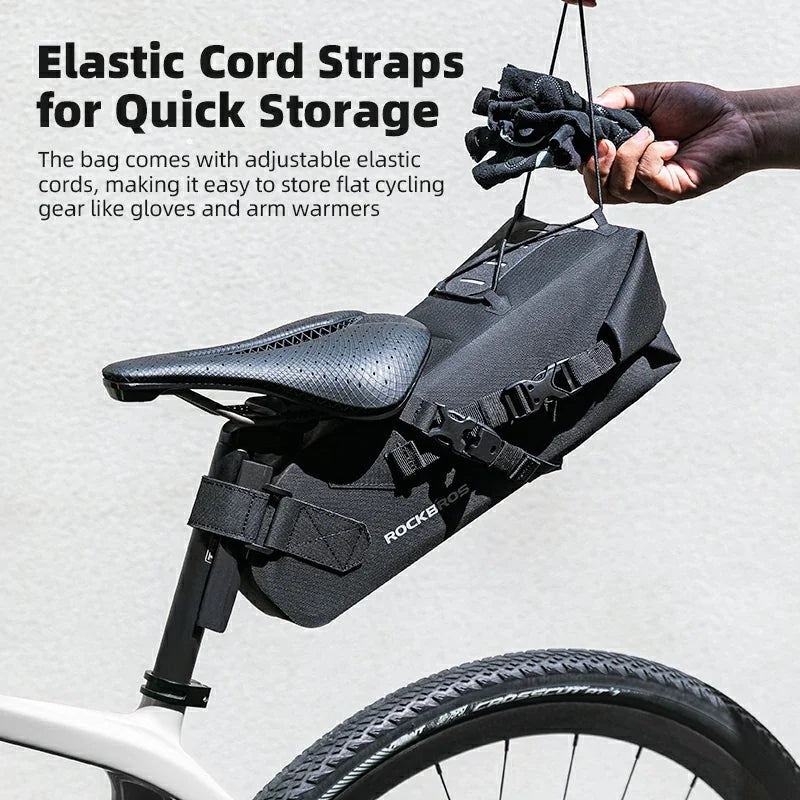 Bicycle saddle bag with elastic cord straps for storing cycling gear on a bike.