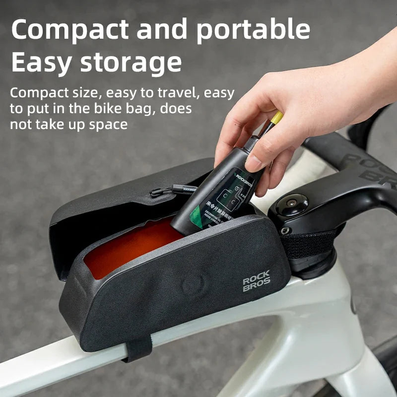 Bicycle handlebar bag with a hand placing items into it, on a blurred background with text about its compactness and portability.