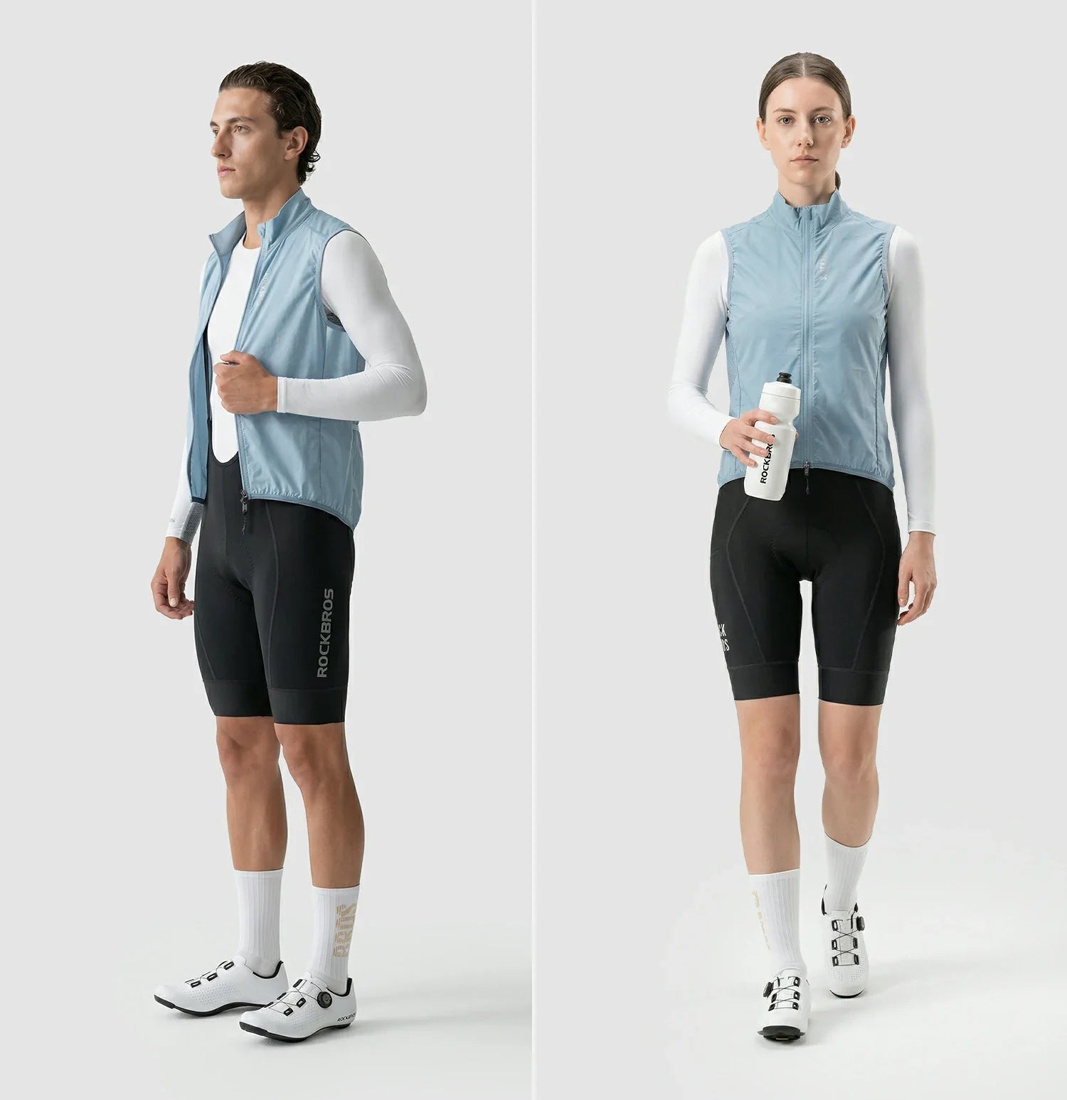 Two people wearing cycling outfits with vests on a white background