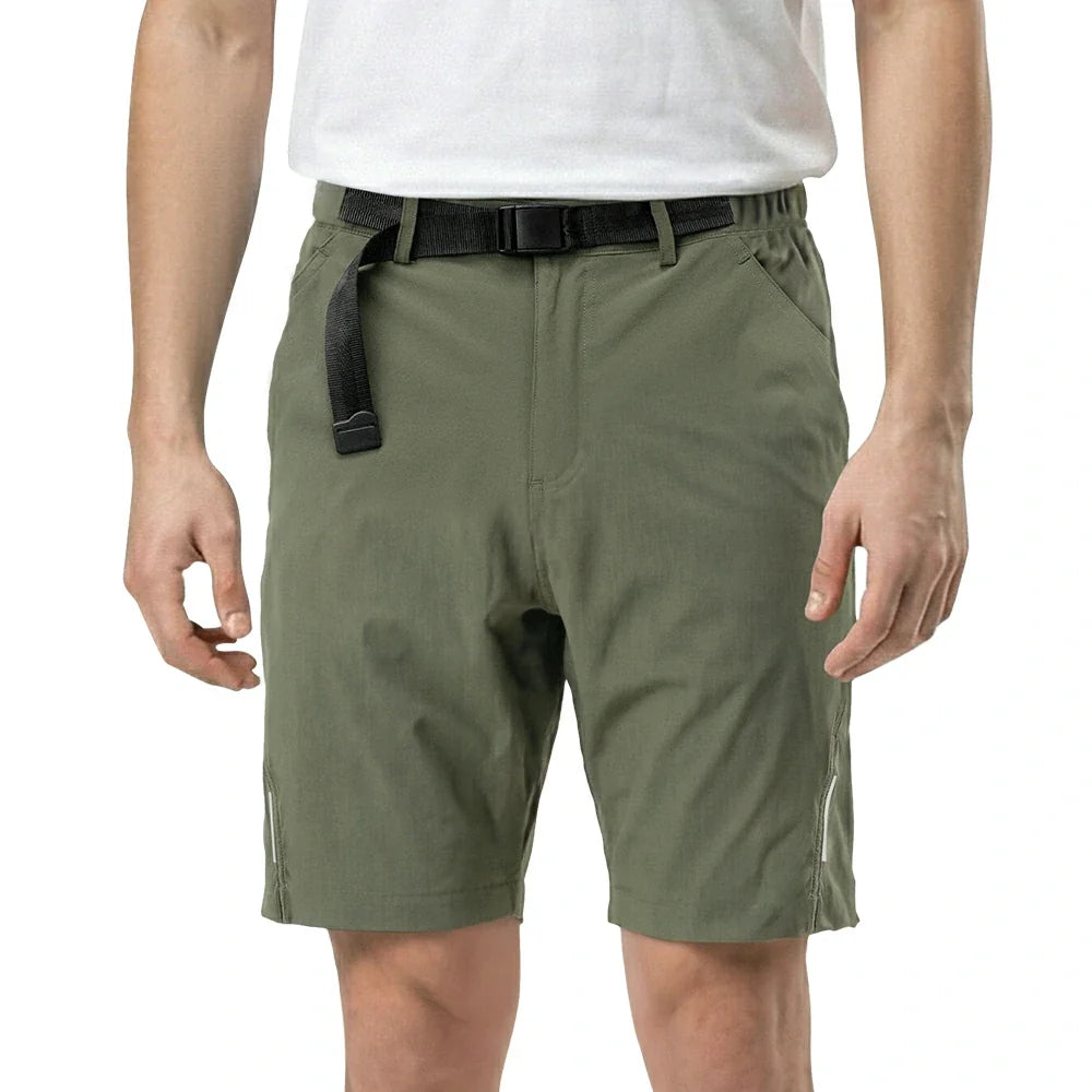 Person wearing olive green shorts on a white background