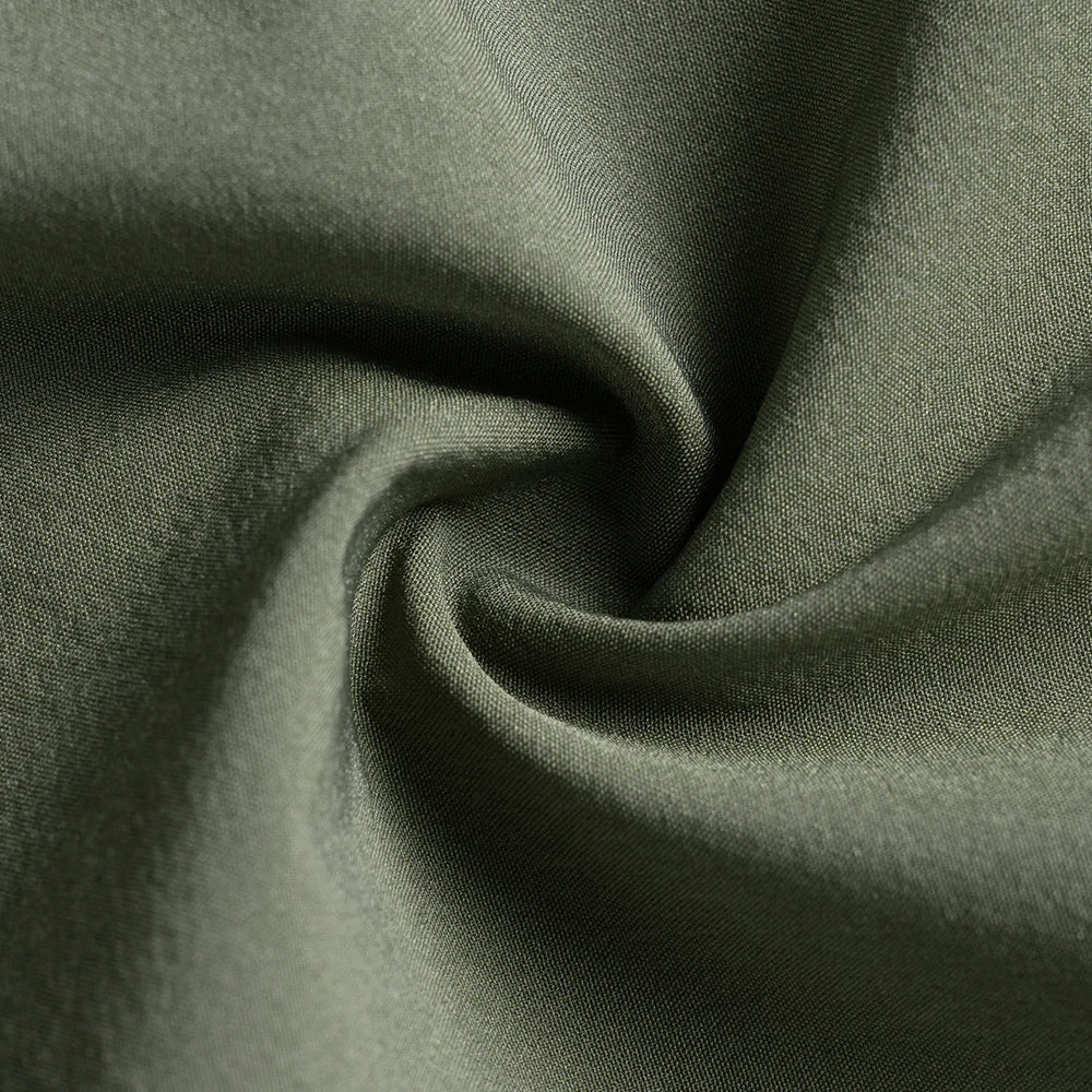 Close-up of green fabric with folds