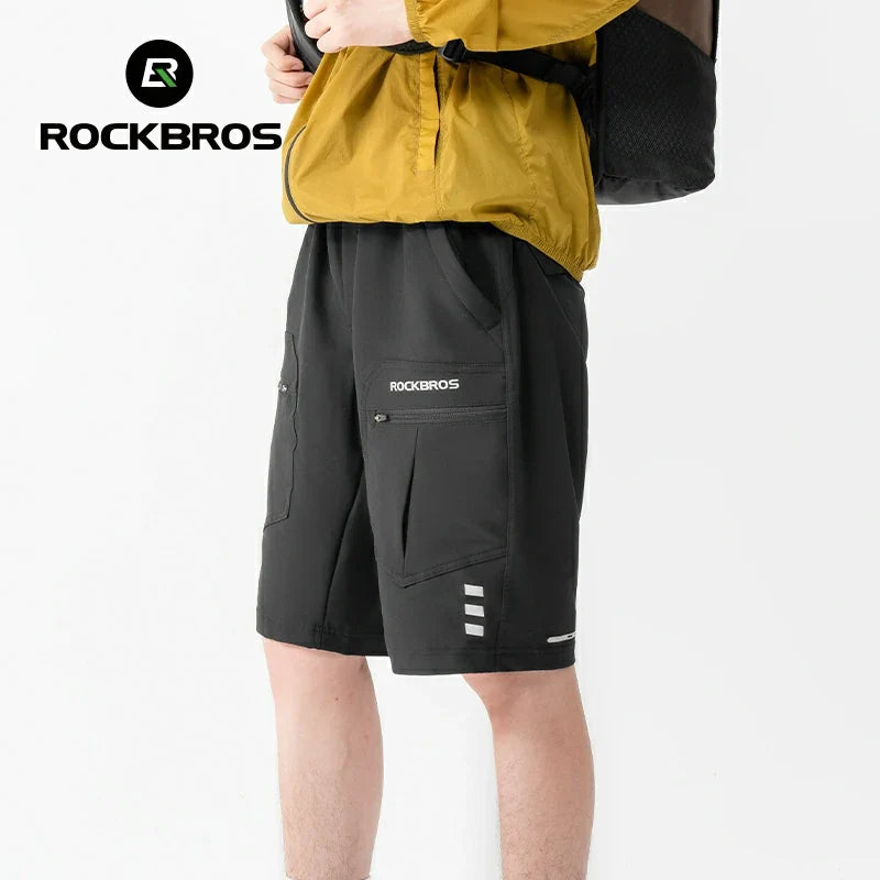 Person wearing black shorts with RockBros branding on a white background