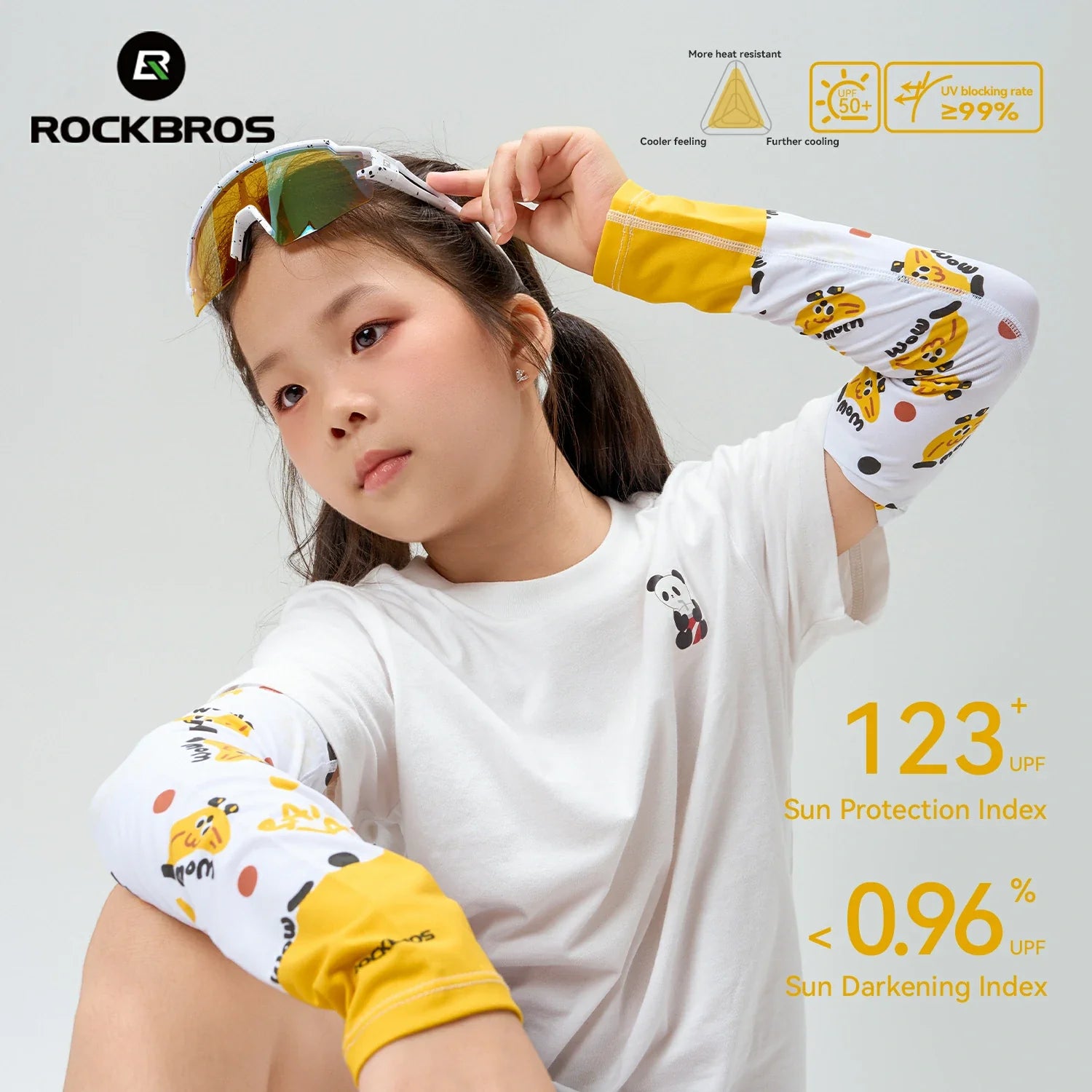 Child wearing sun-protective arm sleeves with RockBros branding and sun protection index details.