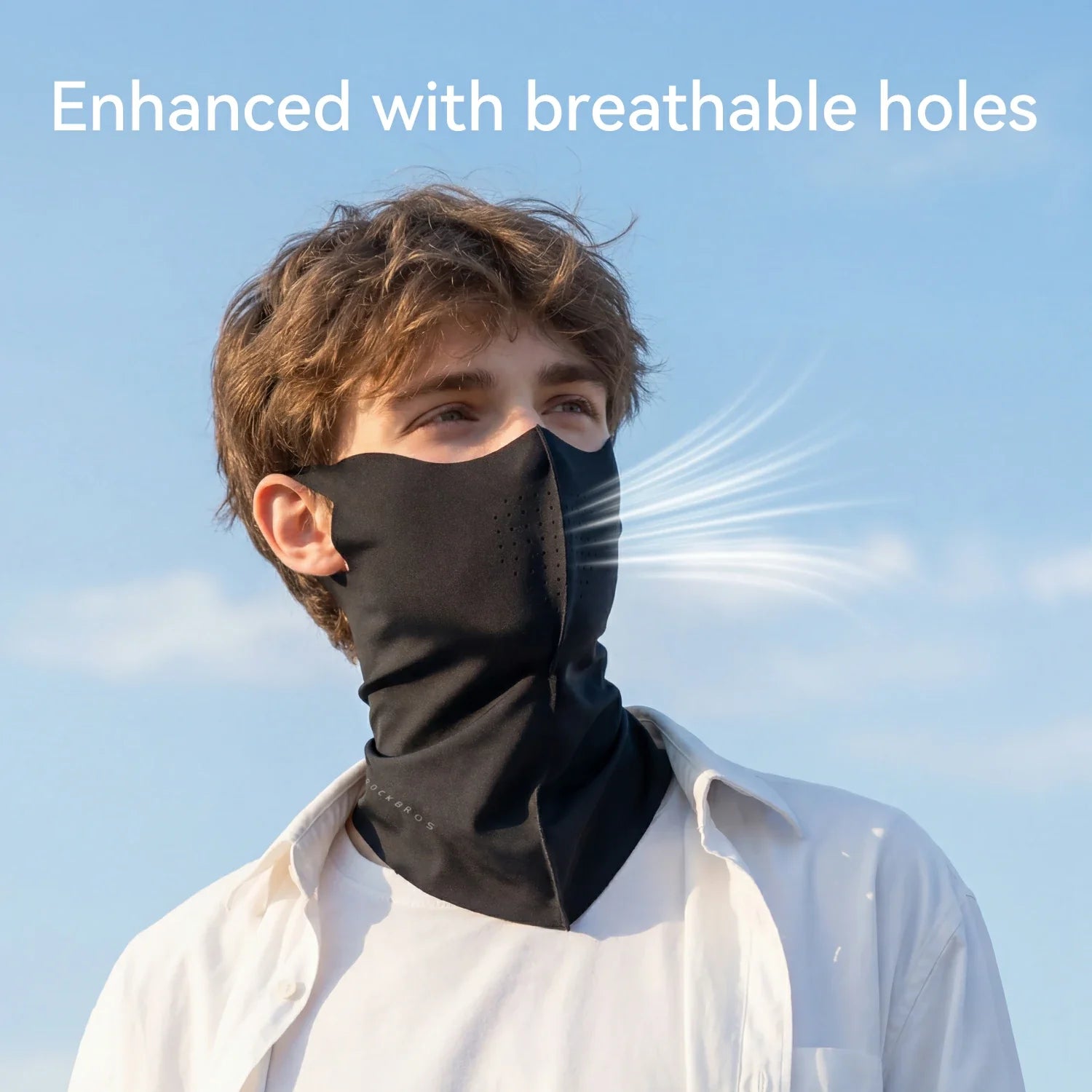 Person wearing a black neck gaiter against a clear blue sky with text 'Enhanced with breathable holes'.