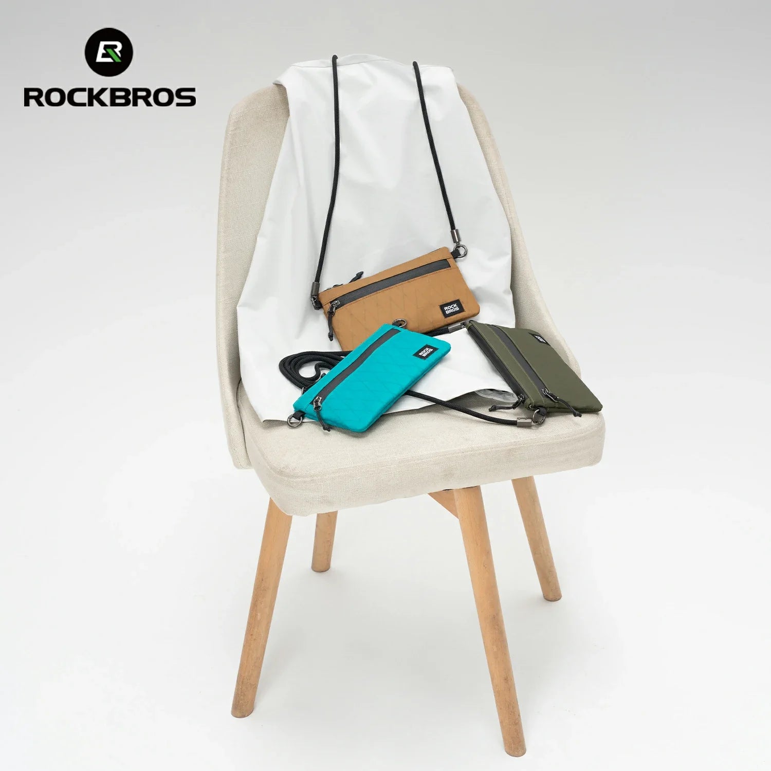 Three small bags on a chair with 'Rockbros' branding.