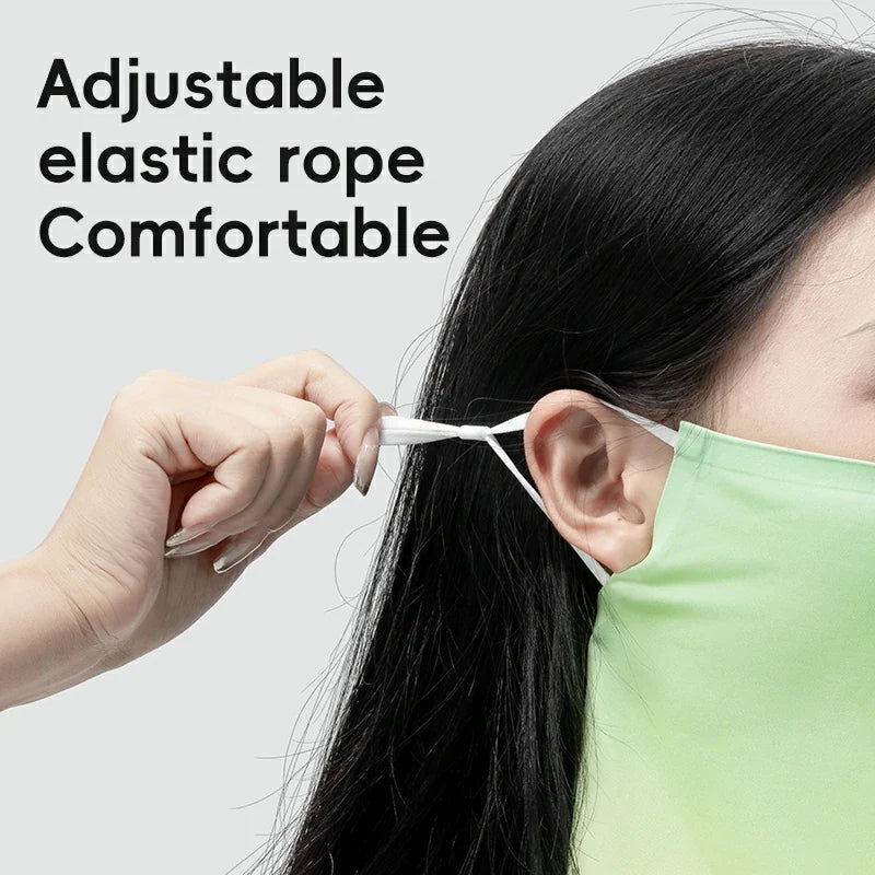 Person adjusting an adjustable elastic rope on a mask with text 'Adjustable elastic rope Comfortable' on a light gray background.
