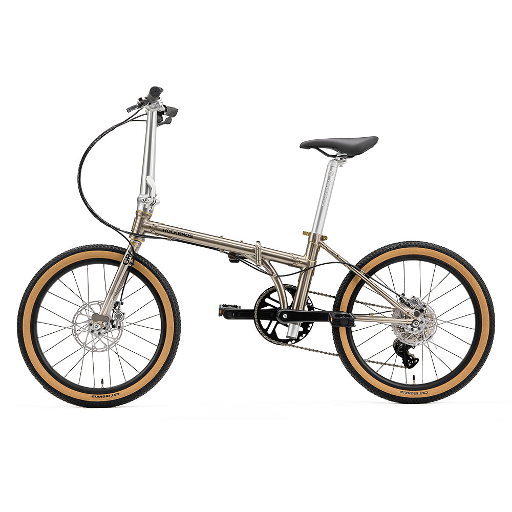 Foldable bicycle with brown tires on a white background #Color_Titanium