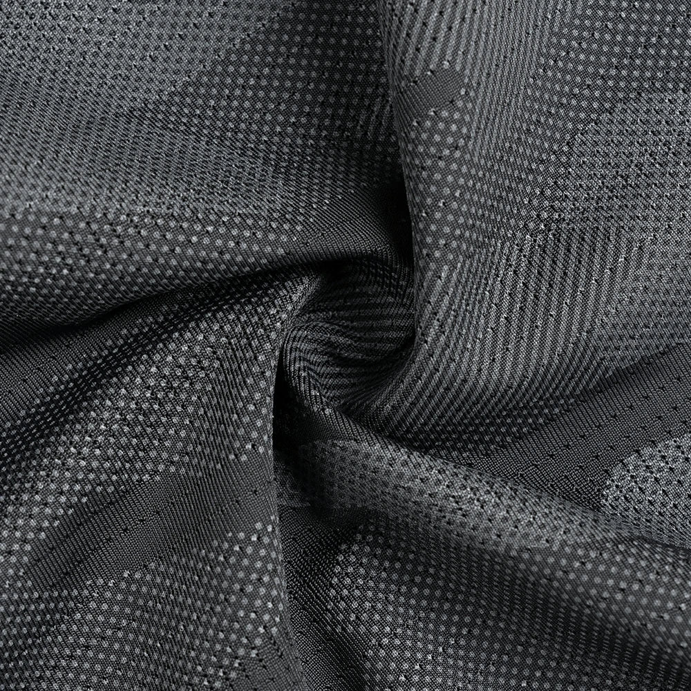 Close-up of textured black fabric with a subtle pattern
