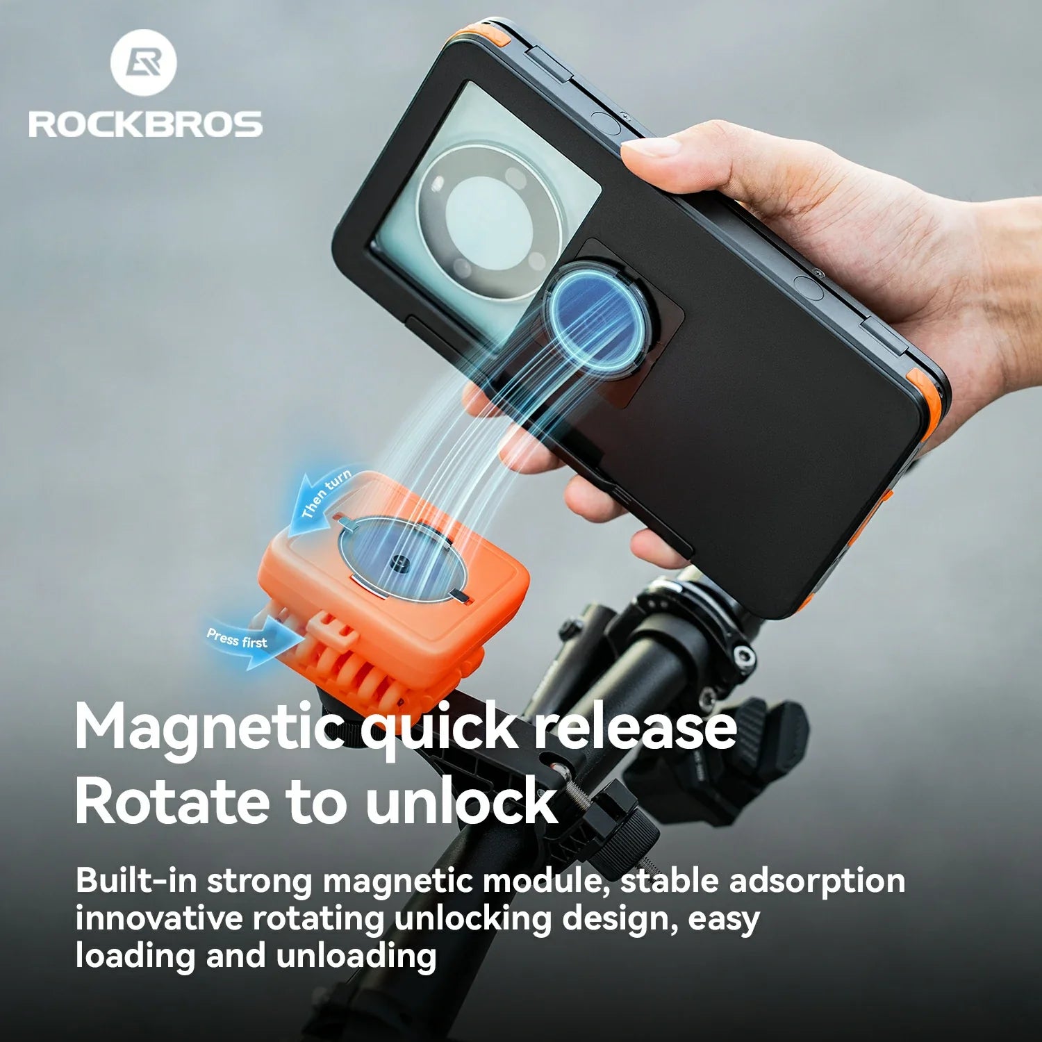 Hand holding a device with magnetic quick release feature, featuring ROCKBROS branding.