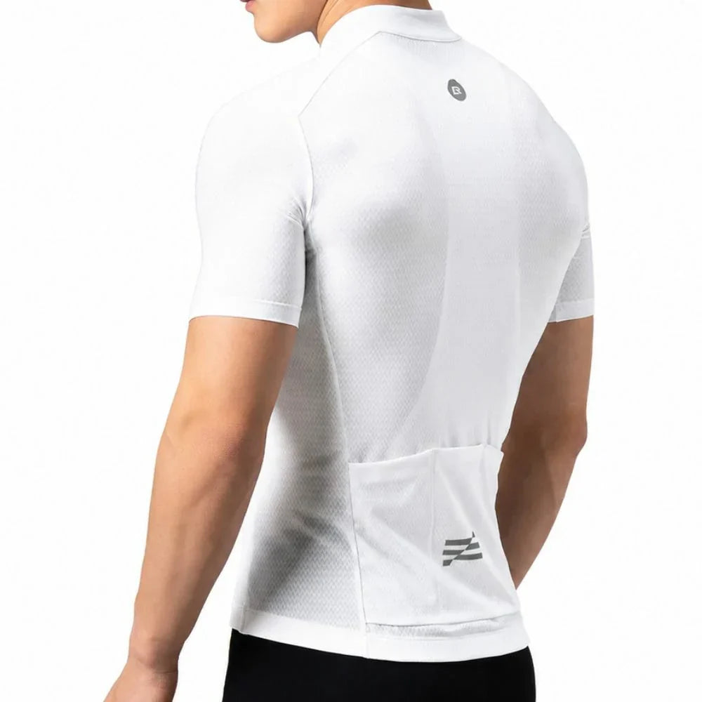 A man wearing a white short-sleeve cycling jersey from the back, showing a mesh texture, a small circular logo near the upper back, and a large rear pocket with a logo near the bottom. #Color_White