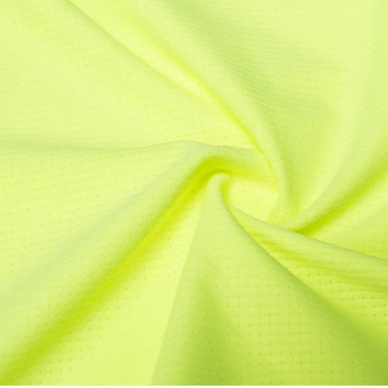 Close-up of bright green fabric with a textured pattern