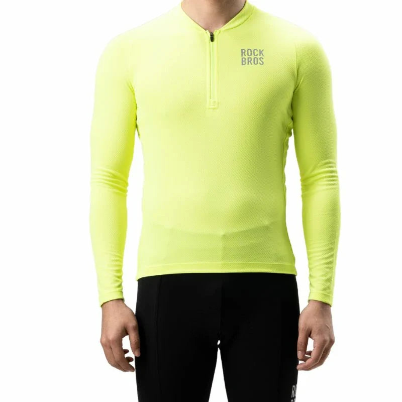 A man wearing a bright neon yellow long-sleeve quarter-zip athletic shirt with 'ROCKBROS' printed in gray on the left chest, paired with black cycling tights, against a plain white background. #Color_Yellow