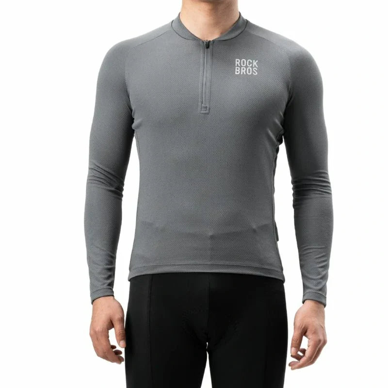 A man wearing a dark gray long-sleeve quarter-zip performance shirt with a white 'ROCK BROS' logo on the left chest, paired with black cycling tights, against a plain white background. #Color_Gray