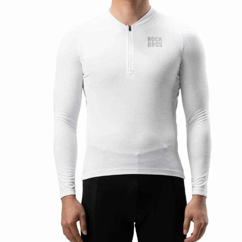 A man wearing a white long-sleeve quarter-zip athletic shirt with 'ROCK BROS' printed on the left chest, paired with black cycling shorts, against a plain white background. #Color_White
