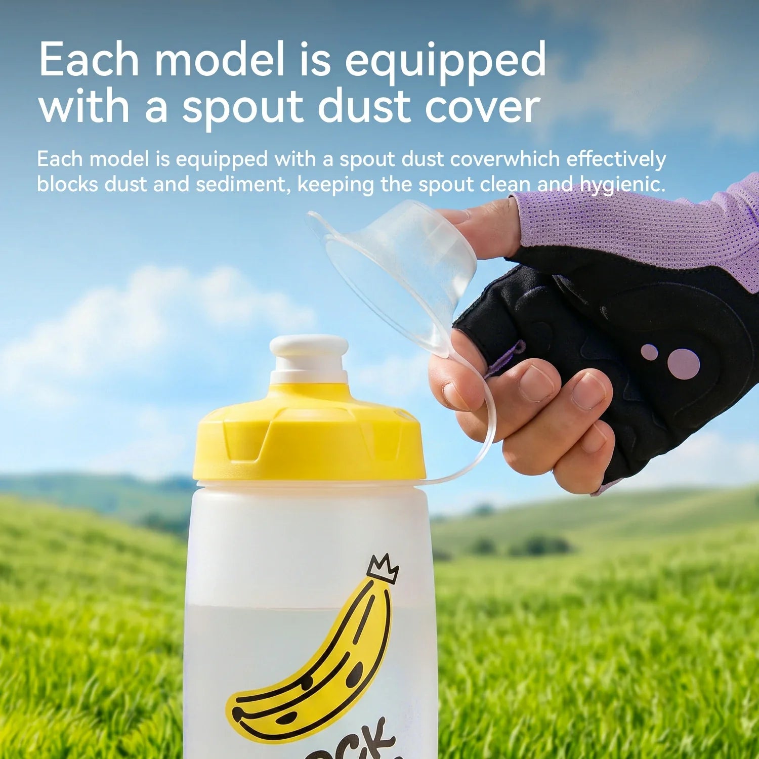 Person holding a water bottle with a spout dust cover against a scenic background