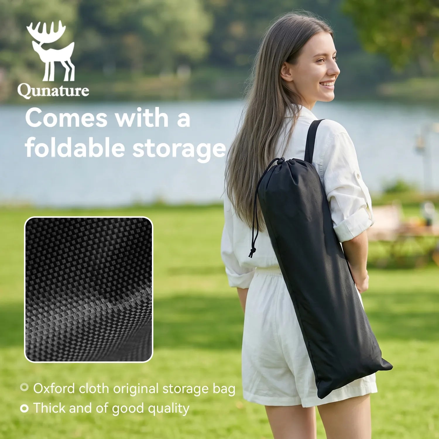 Woman holding a black Oxford cloth storage bag with Qunature branding in an outdoor setting.