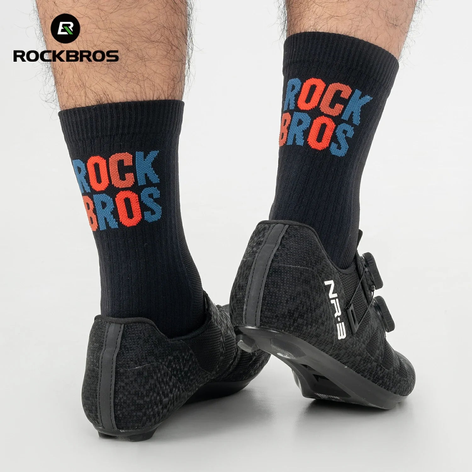 Black socks with 'RockBros' branding worn with black shoes on a white  #color_black
