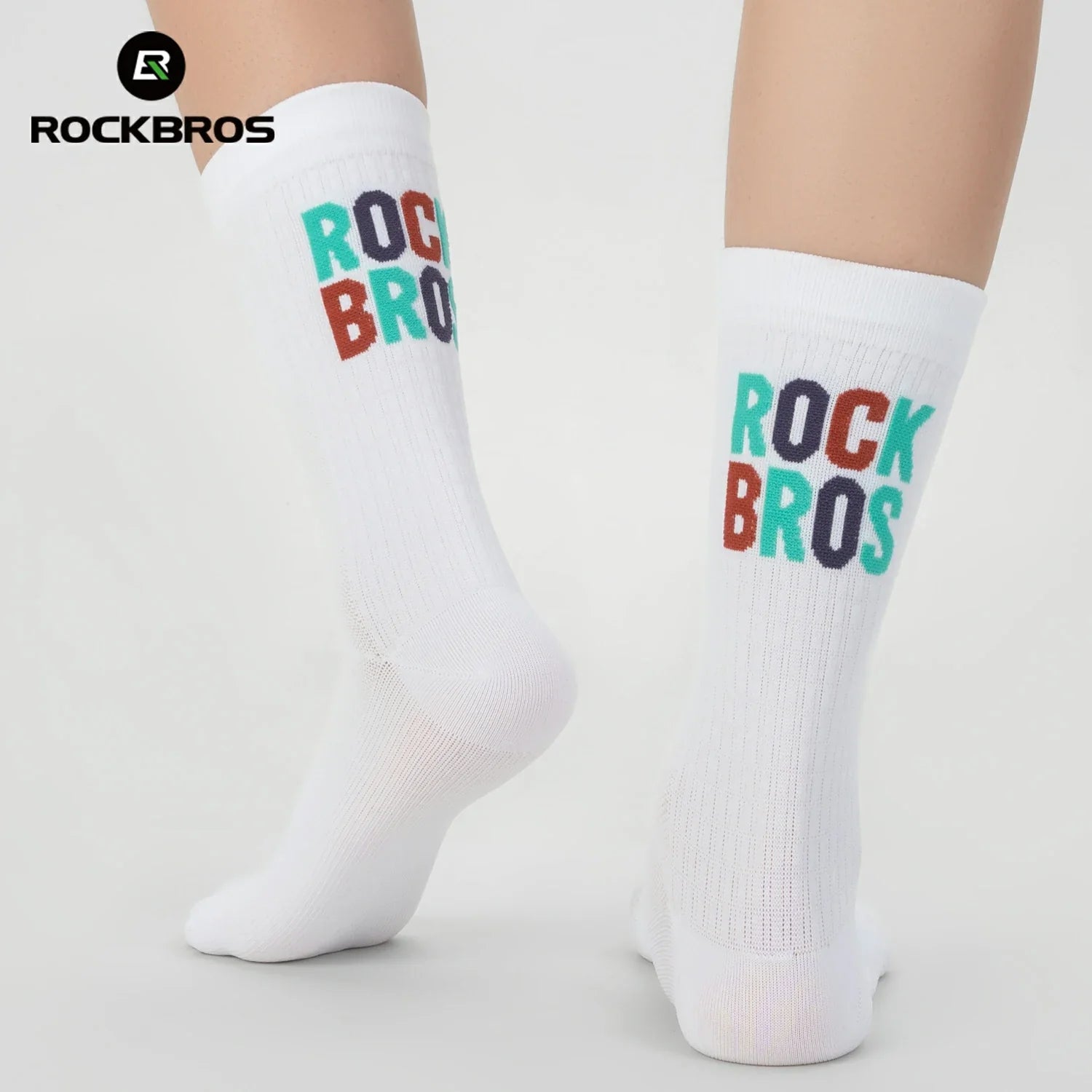 White socks with 'ROCKBROS' text in multicolor on a light gray background, featuring the brand logo. #color_white