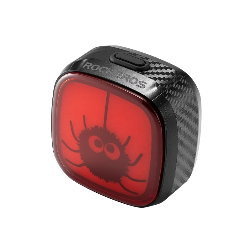 small cartoon spider hanging on a red bicycle tail light #Color_Little Spider