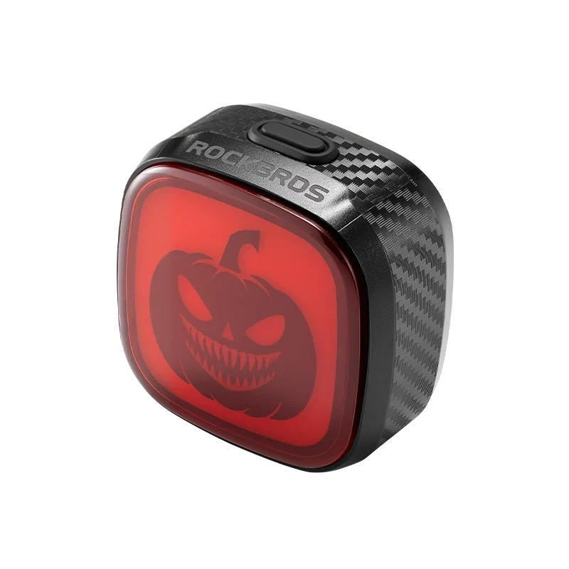 pumpkin lantern halloween pattern on a red bicycle tail light #Color_Jack-o'-lantern