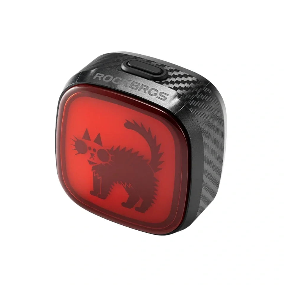 scared cat with fur standing up on a red bicycle tail light #Color_Spooked Cat