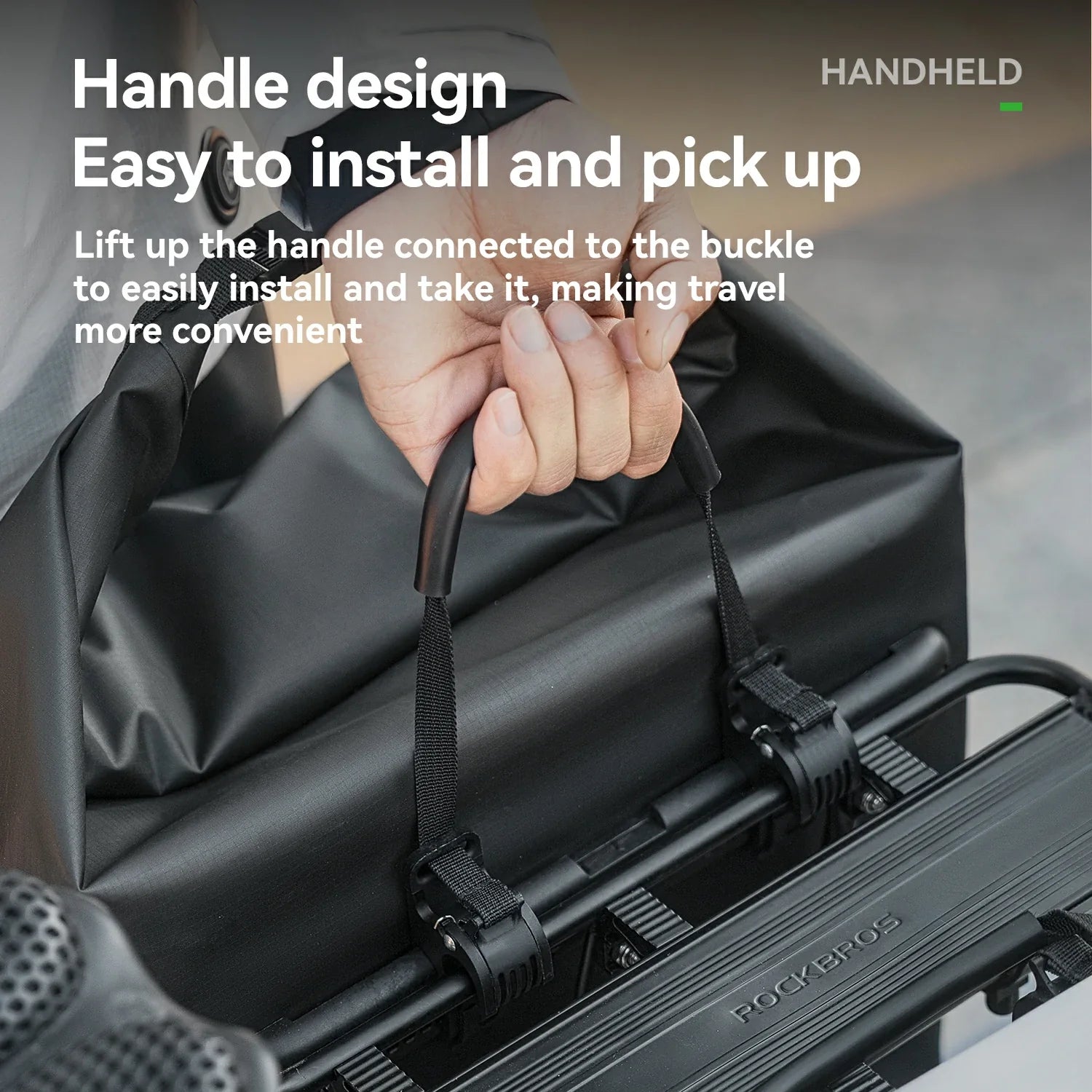Hand holding a handle on a black suitcase with text about handle design