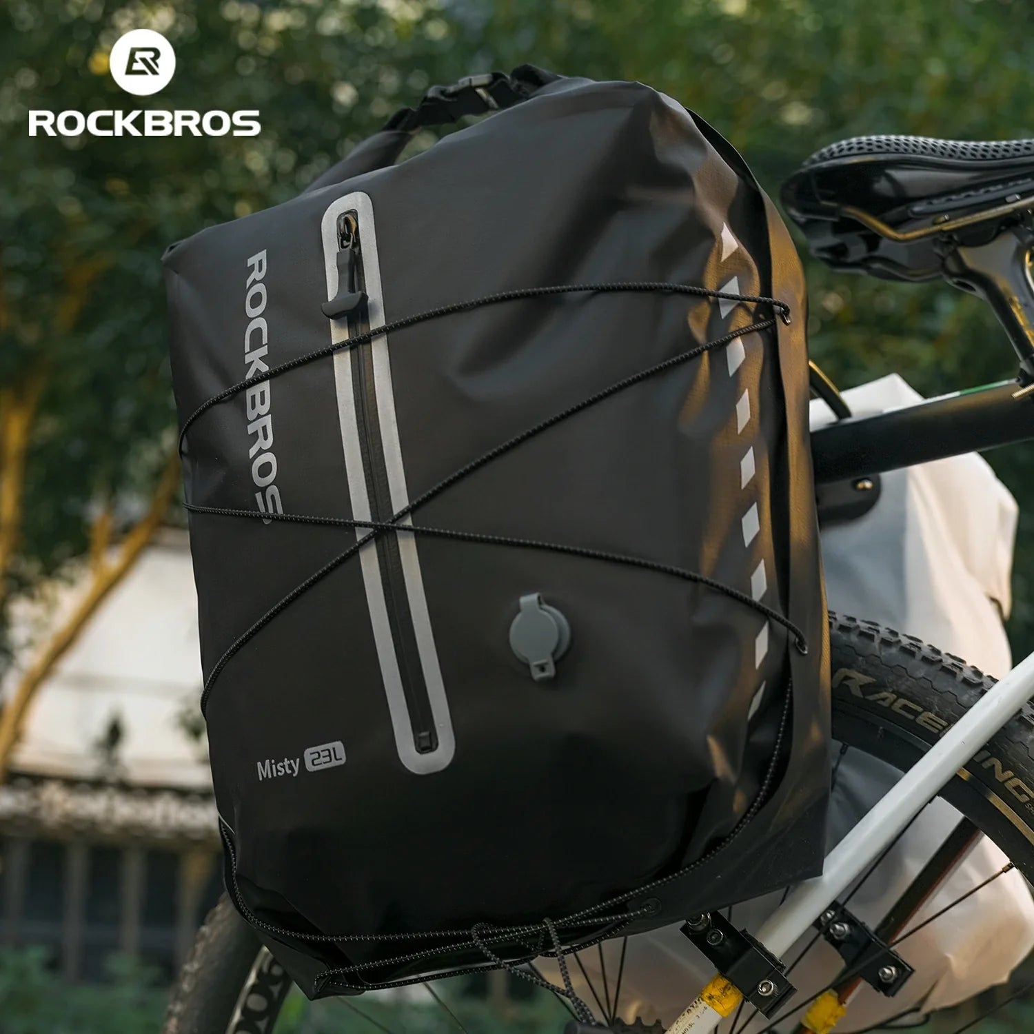 Black bicycle bag with 'RockBros' branding attached to a bike, outdoors. #color_black