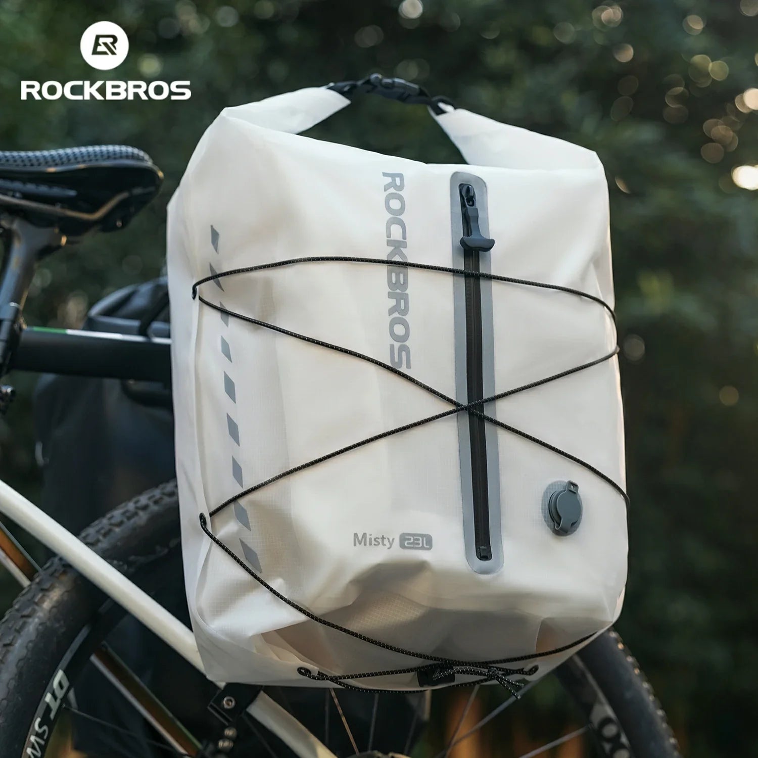 White bicycle saddle bag with 'RockBros' branding attached to a bike, set against a blurred natural  background. #color_white