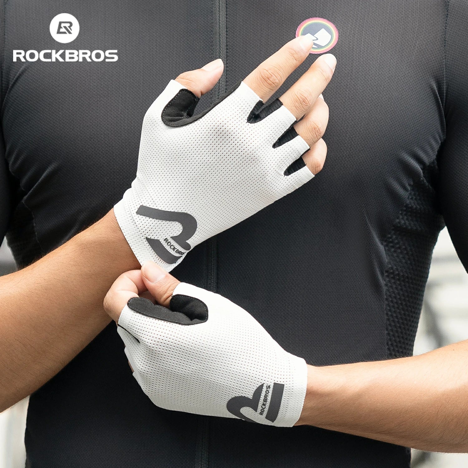 Person wearing white gloves with black accents, featuring the RockBros brand logo. #color_white