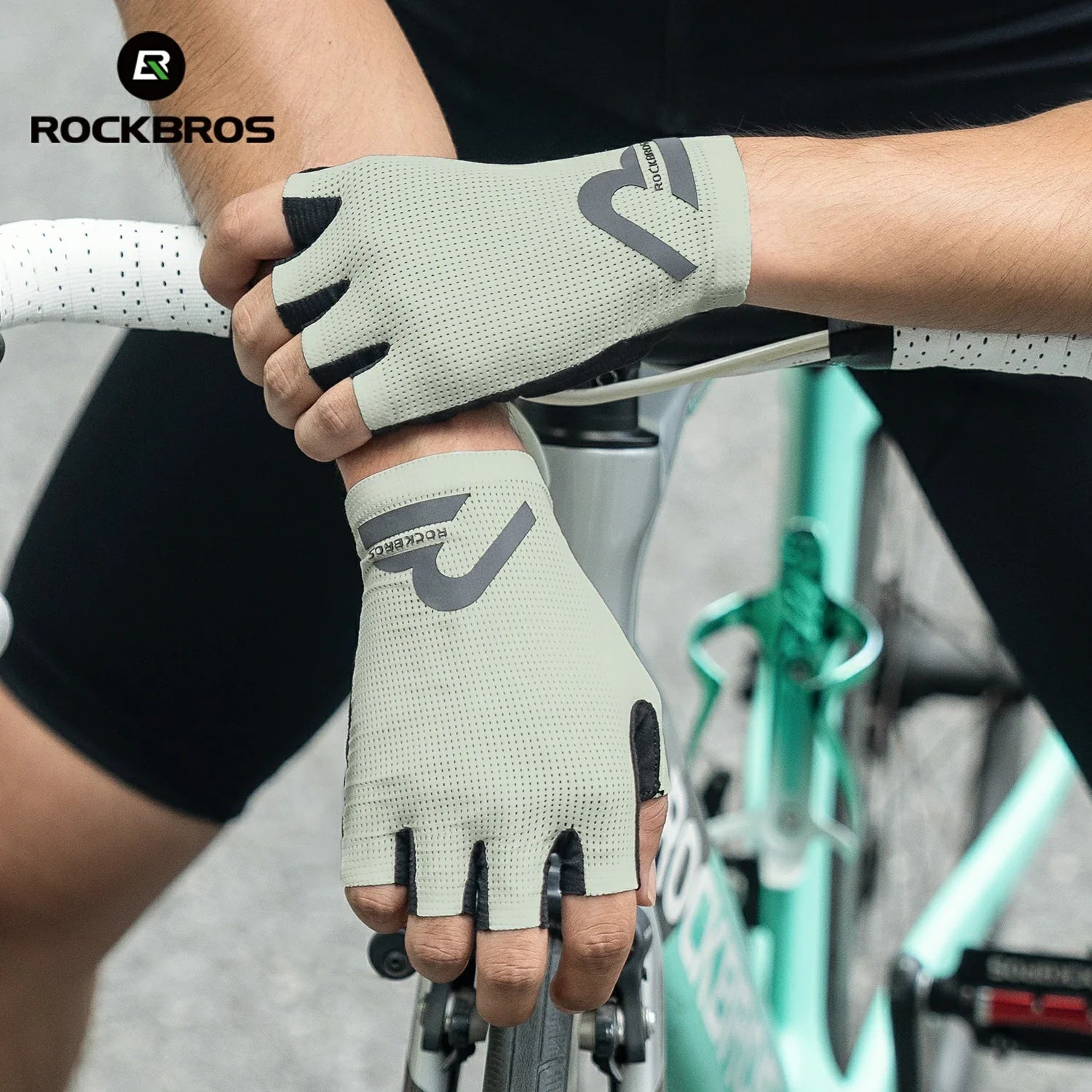 Person wearing cycling gloves holding a bike handlebar with 'RockBros'  branding. #color_Beige