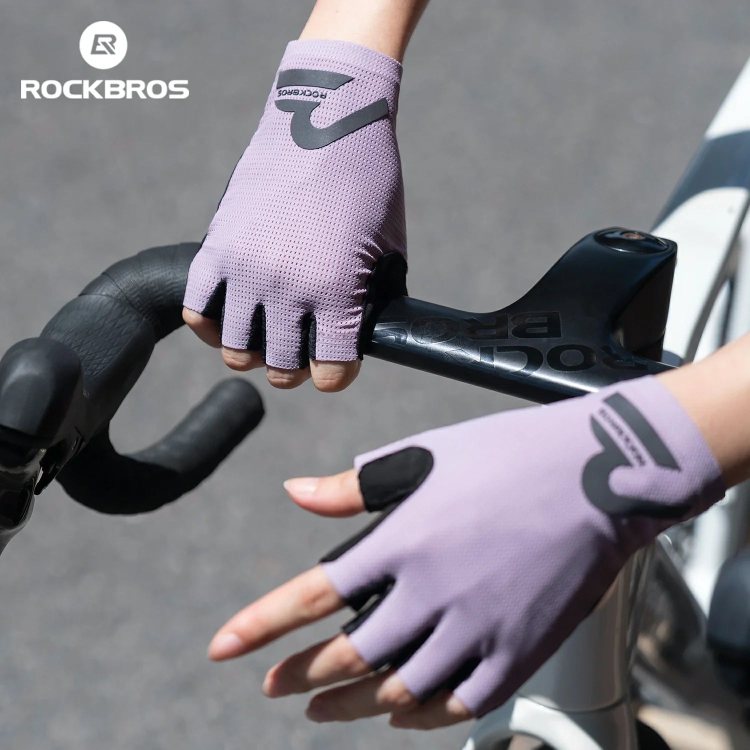 Purple cycling gloves with 'RockBros' branding on a bike handlebar. #color_purple