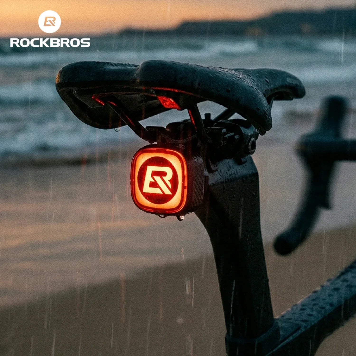 ipx5 waterproof bicycle taillight installed on a bike saddle in rainy conditions